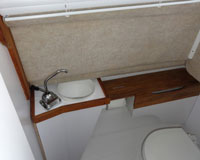 Retractable sink in head allows for more room as needed