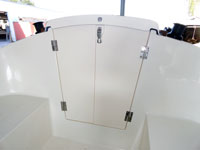The cabin is closed and secured with a sliding companionway hatch and solid poly, hinged doors.