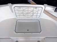 The cockpit icebox drains overboard.
