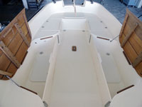 Full of lockers: Two fiberglass seat lockers provide access to inside hull storage, and two hinged teak seats that provide access to wet storage