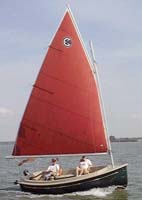 Picnic Cat under full sail with optional tanbark sail