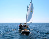 Sun Cat and dinghy on Lake Huron